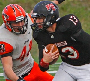 Two American football players in action; one in a black uniform holding the ball, being tackled by another in a white and orange uniform marked number 48.