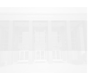 An image of a building with large glass windows and the words "Christ" and "Career" partially visible through the window reflections.