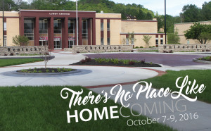 Image of a university campus with a building in the background and text overlay reading "There's No Place Like Homecoming" in stylized font. The name Kentucky Christian University is partially visible on a stone sign, reminding alumni of cherished memories as they return to their alma mater.